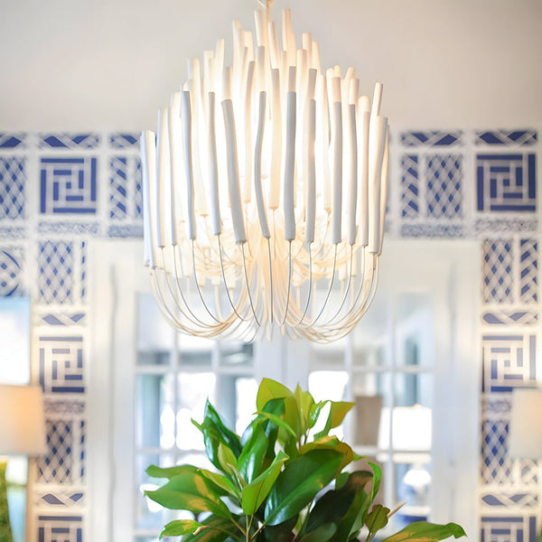 Chandelier over a modern dining room table