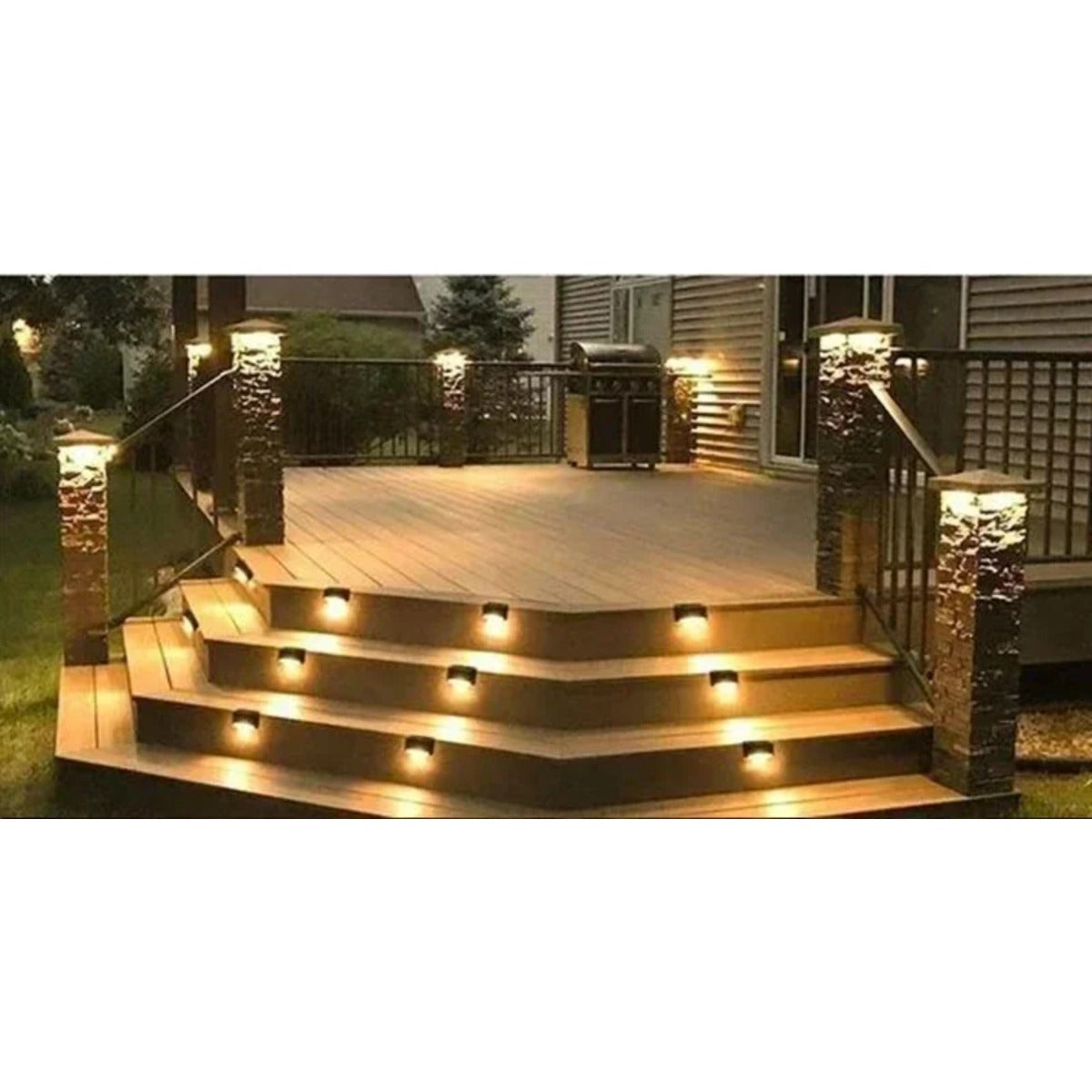 Solar deck lights on porch steps at night
