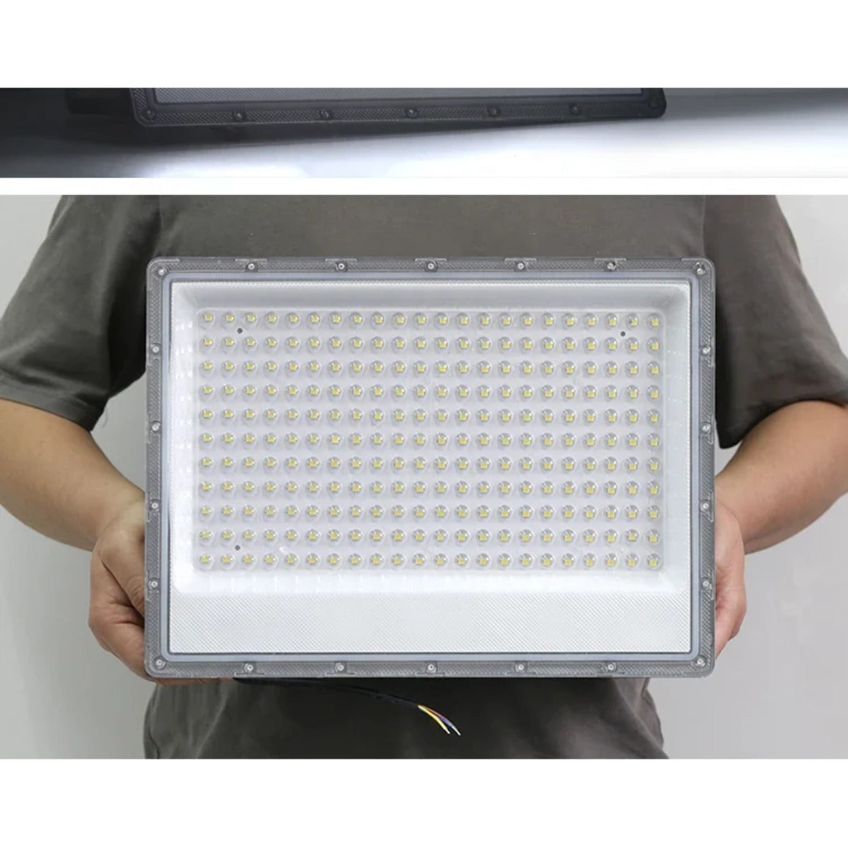 LED flood light held in hands