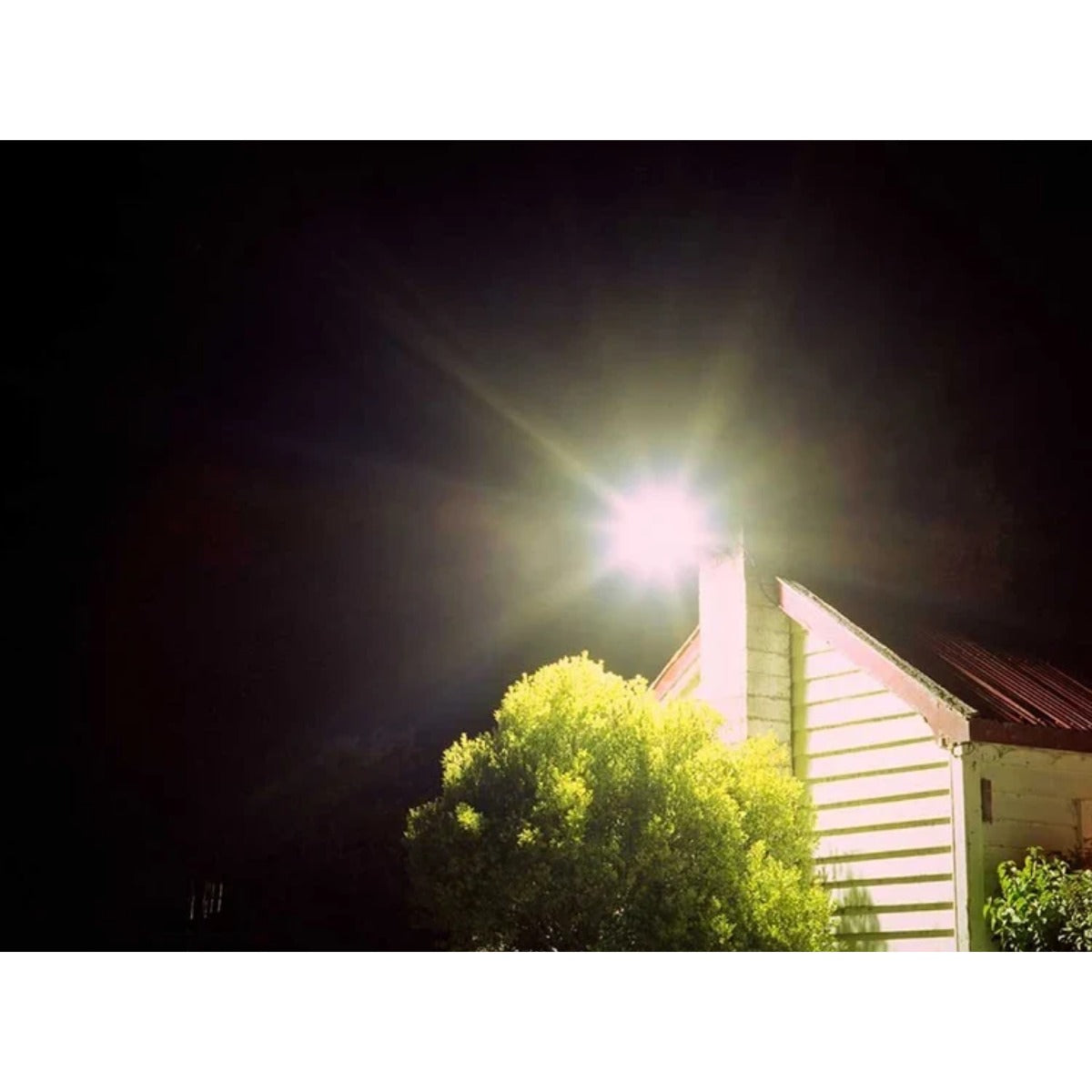 LED flood light illuminating house