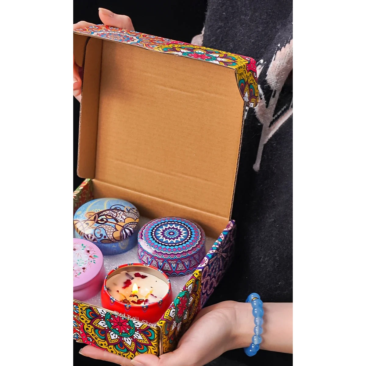 Scented candle gift box in hands