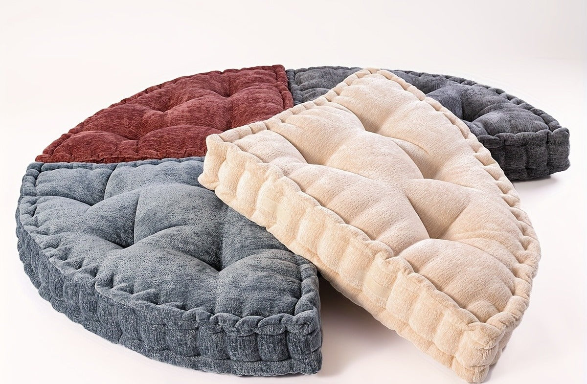 Four quarter round chenille floor cushions arranged into a circle