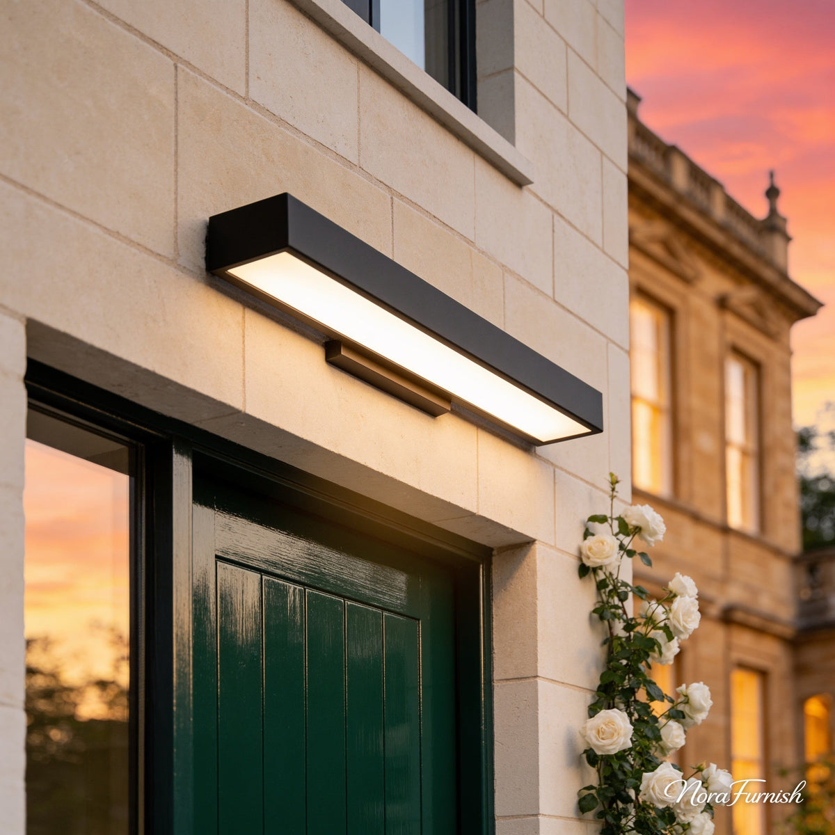 Rectangular Wall Light above a forest green door on a limestone wall