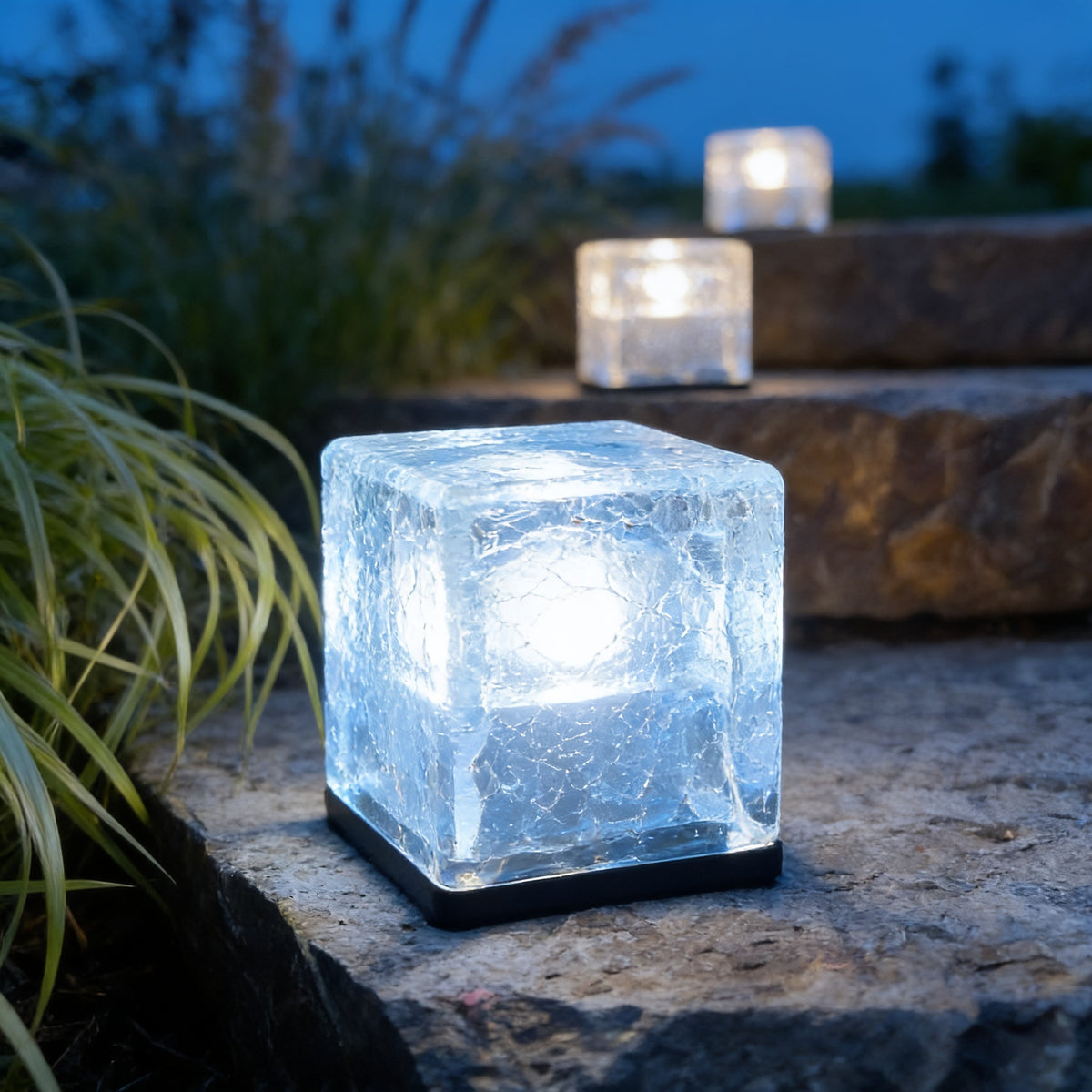 Ice Cube Step Light in white on flagstone steps