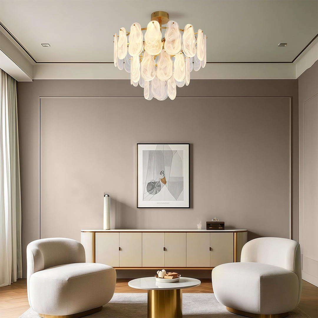 Chandelier above marble furniture
