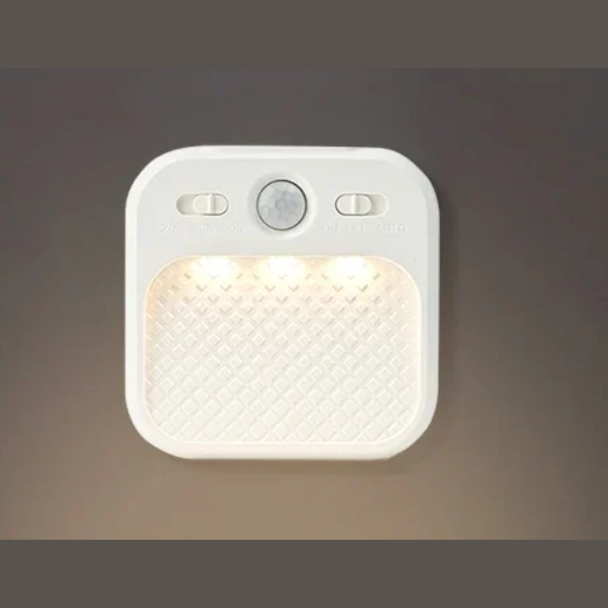 Motion sensor night light glowing on wall