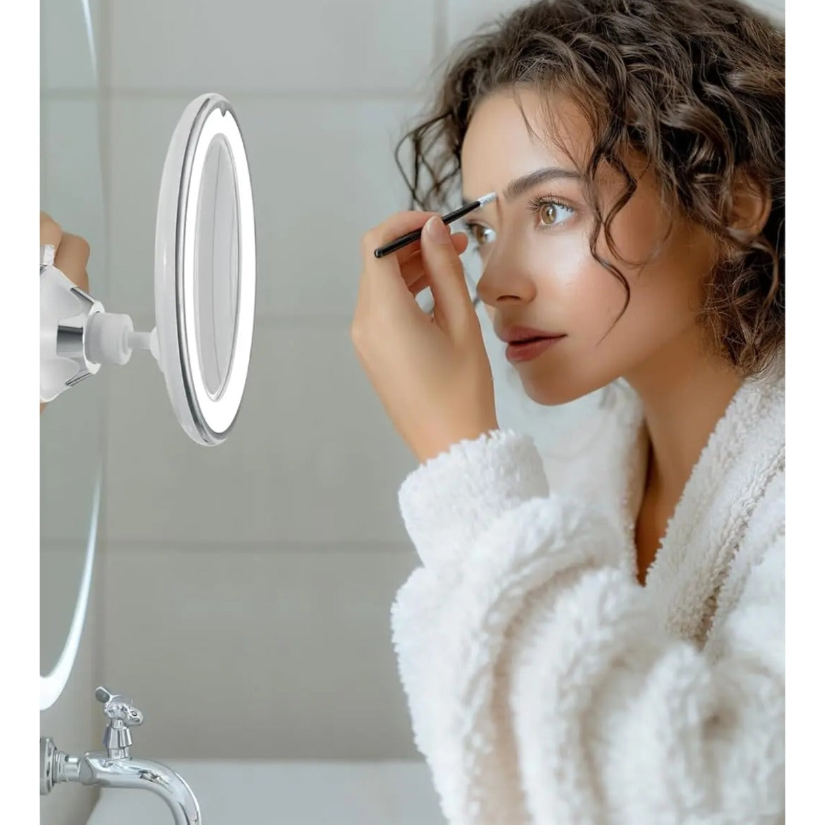 Applying makeup with the 10X suction mirror