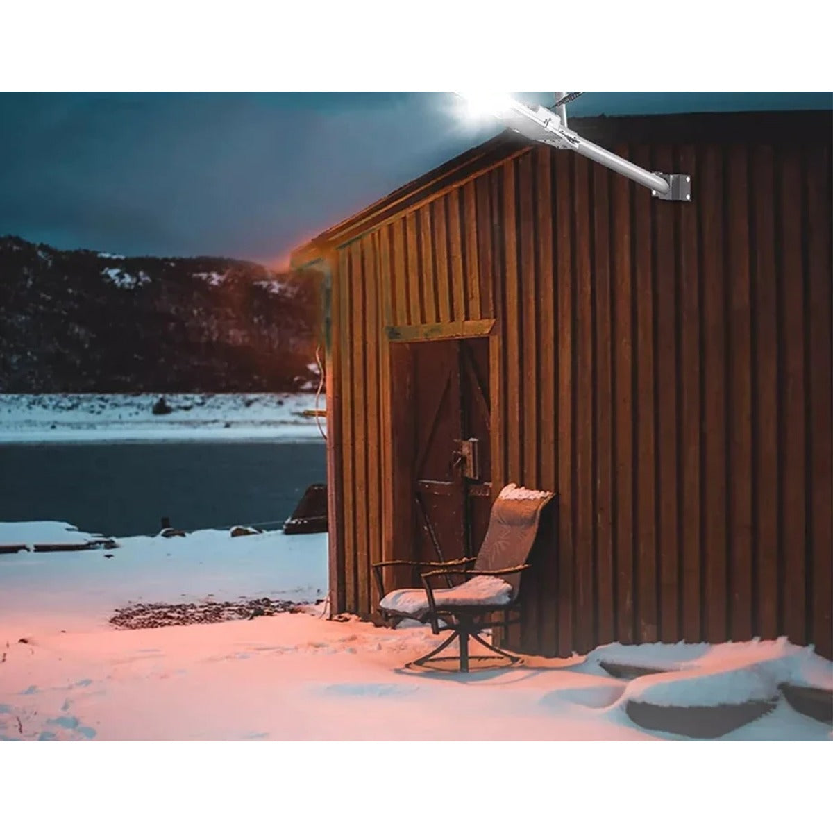 Solar light on snowy cabin