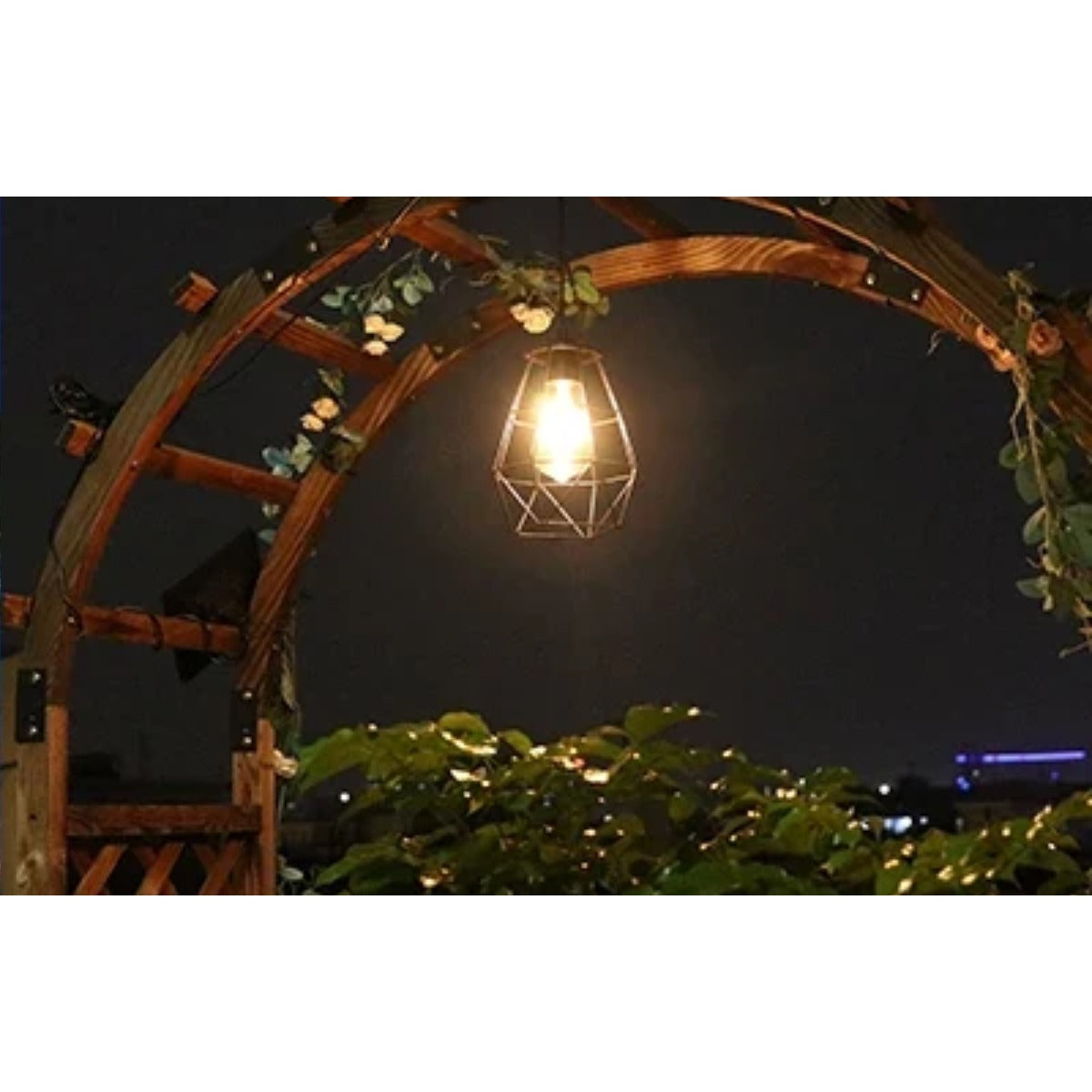 Pendant light on garden arch