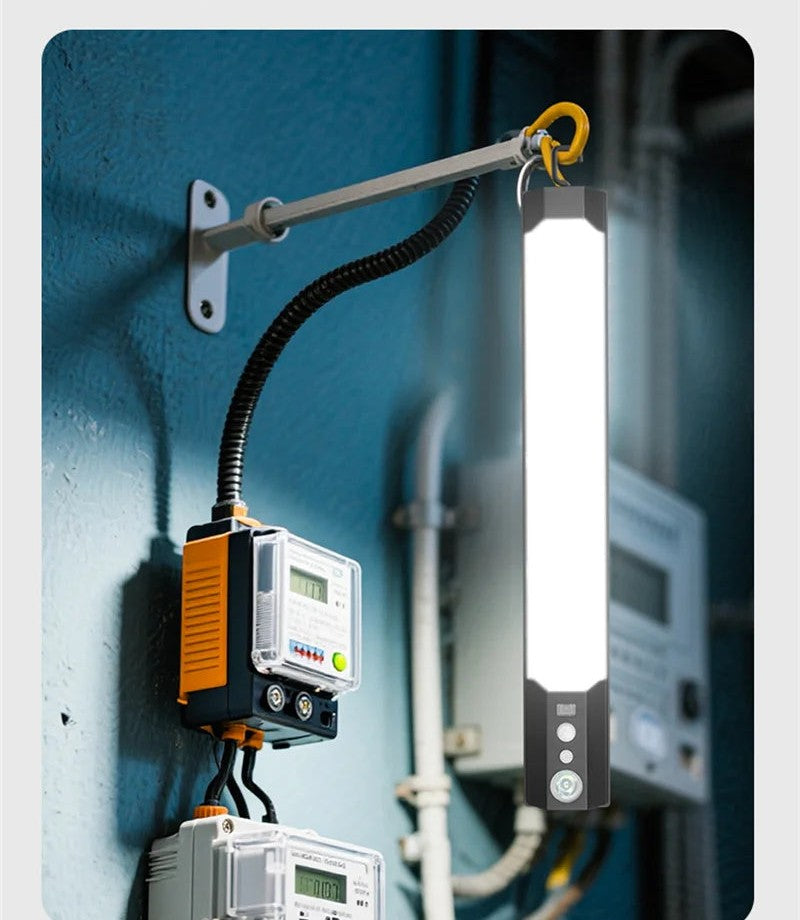 Solar wall lamp lit on a hook over utility meters