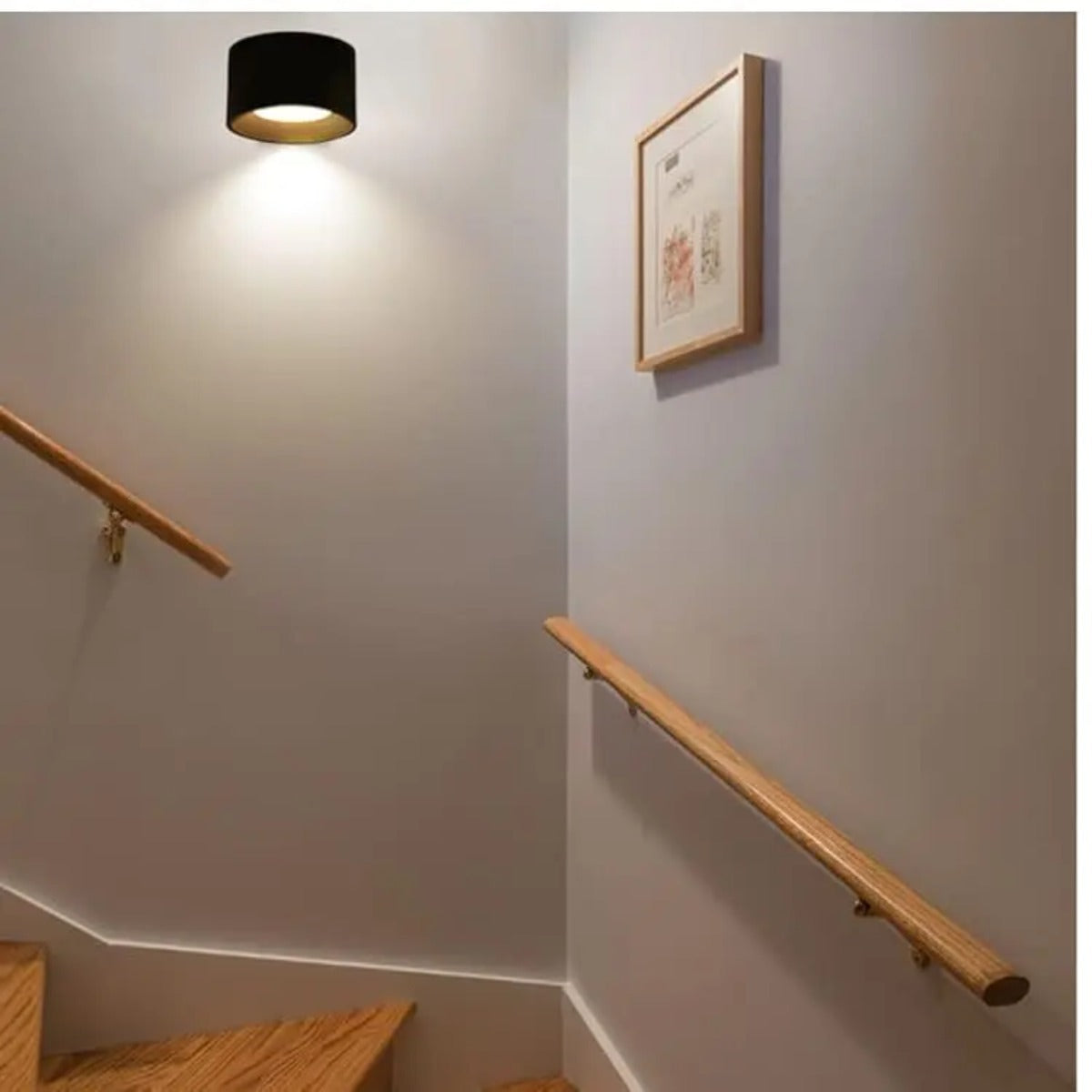 Wall lamp above handrail