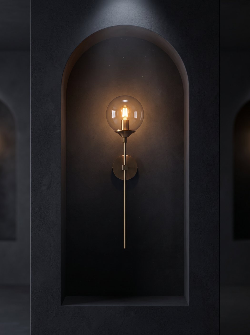 Amberline glass globe sconce in a dark arched alcove